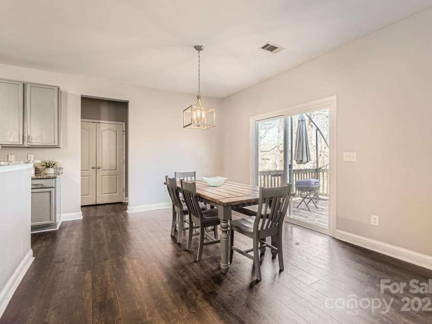 141 Silverspring Place, Mooresville, NC 28117.  MLS# CAR4218653, YatesRealty ID 8869. Nope...not your Dining Room! You have one of those. This is your Huge Dining Area! With sliding patio doors to your deck!