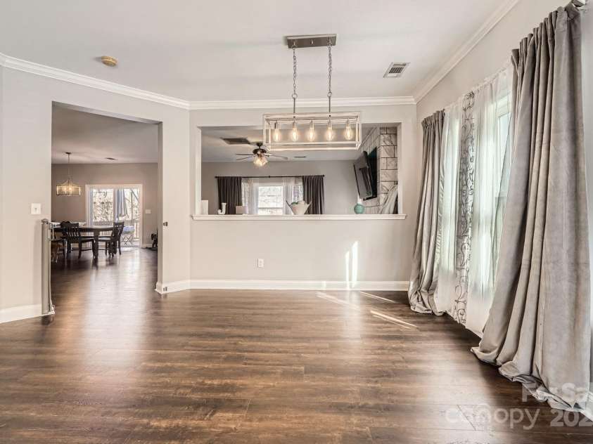 141 Silverspring Place, Mooresville, NC 28117.  MLS# CAR4218653, YatesRealty ID 8869. Step into your front entry into your open floor plan Living Room and Dining Room!