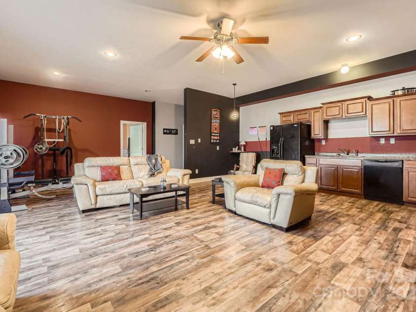 141 Silverspring Place, Mooresville, NC 28117.  MLS# CAR4218653, YatesRealty ID 8869. Walk downstairs to your Man Cave, She Sanctuary, or your Grand Apartment with a walk out entrance to rear patio and yard! Plus so much storage and separate w/d hookup!