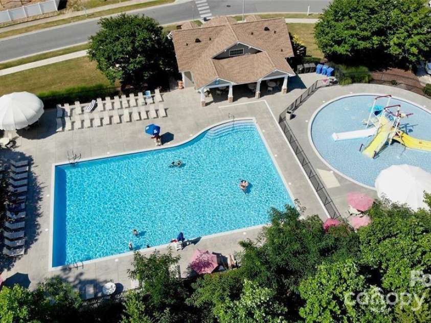 141 Silverspring Place, Mooresville, NC 28117.  MLS# CAR4218653, YatesRealty ID 8869. WOW! Your Community Pools! What fun! Or just relax..take a leisurely swim!