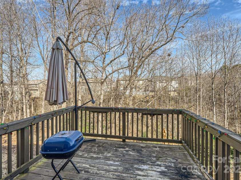 141 Silverspring Place, Mooresville, NC 28117.  MLS# CAR4218653, YatesRealty ID 8869. Your deck is the perfect location to get what you need from the kitchen! Enjoy!