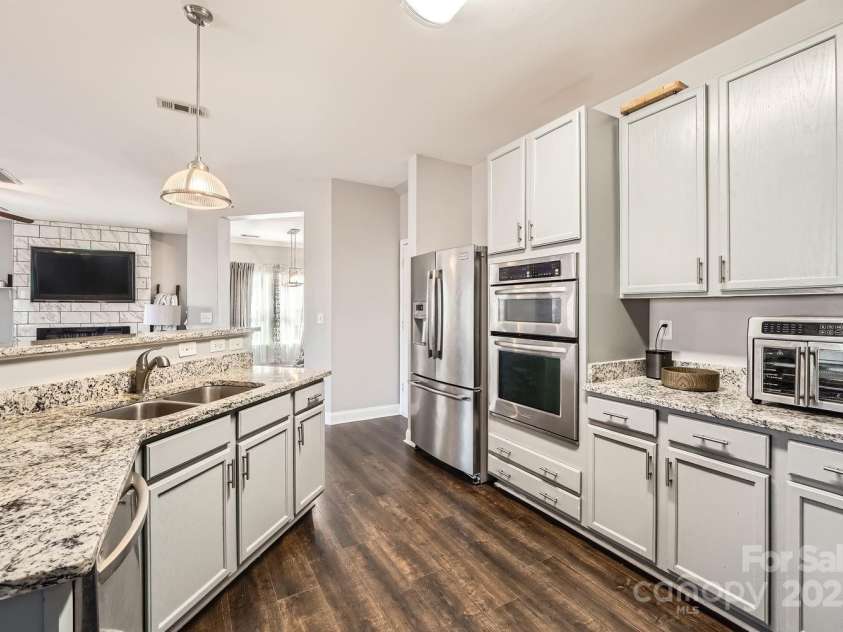 141 Silverspring Place, Mooresville, NC 28117.  MLS# CAR4218653, YatesRealty ID 8869. Your Kitchen has so many cabinets and counters and is easily accessible to your Kitchen needs!