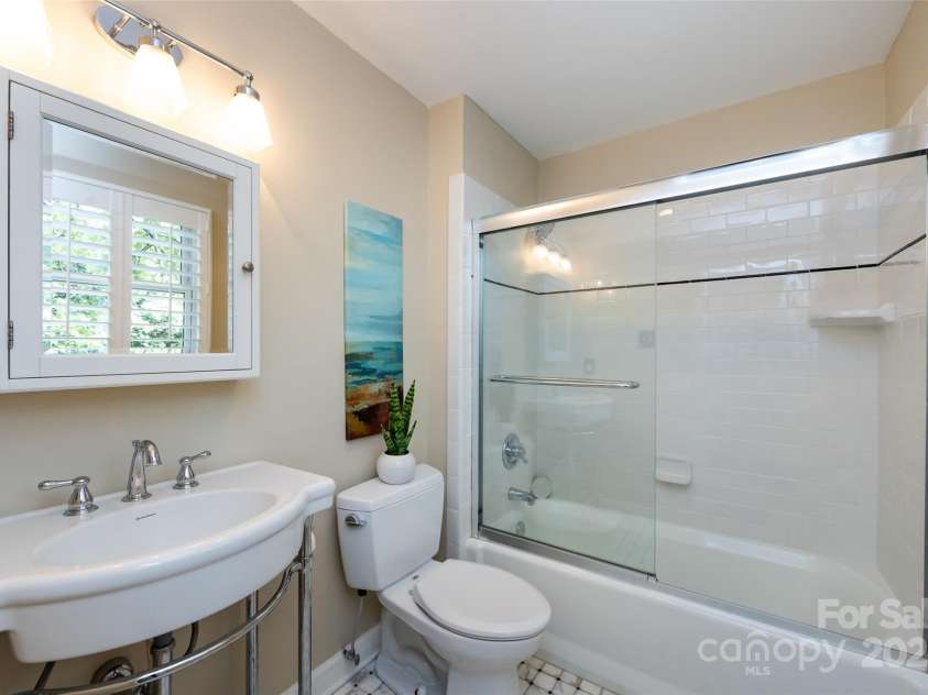 757 Concord Road, Davidson, NC 28036.  MLS# CAR4265019, YatesRealty ID 8872. En-suite bathroom off the third bedroom on the second level features a tub-shower combination