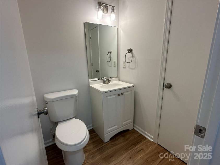 8829 Michaw Court, Charlotte, NC 28269.  MLS# CAR4246491, YatesRealty ID 8872. Half bath downstairs