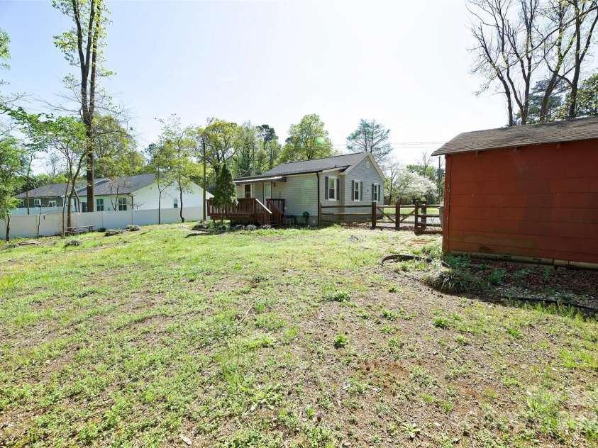6124 Old Plank Road, Charlotte, NC 28216.  MLS# CAR4243091, YatesRealty ID 8887. Red Barn in Backyard, for extra storage