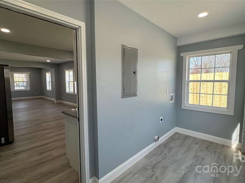 702 Grover Street, Shelby, NC 28150.  MLS# CAR4237734, YatesRealty ID 8888. Laundry room off of kitchen/ rear of house entry.