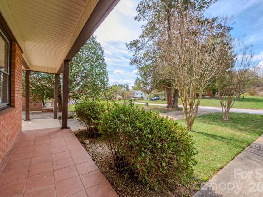 8 Summit Drive, Arden, NC 28704.  MLS# CAR4360548, YatesRealty ID 8889. Front porch