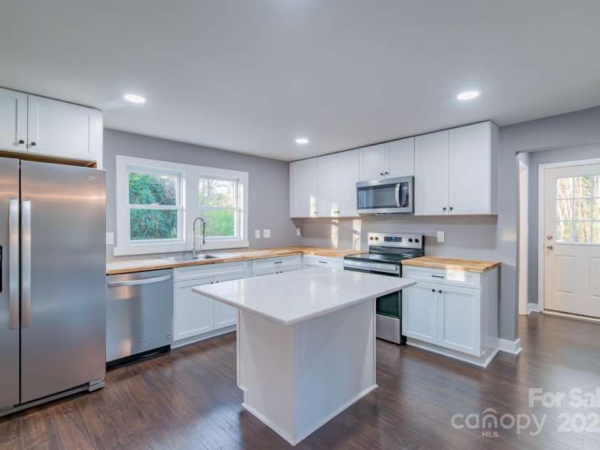 6282 Richburg Road, Great Falls, SC 29055.  MLS# CAR4235952, YatesRealty ID 8890. Kitchen equipped with new stainless appliances, island and butcher block counter tops.