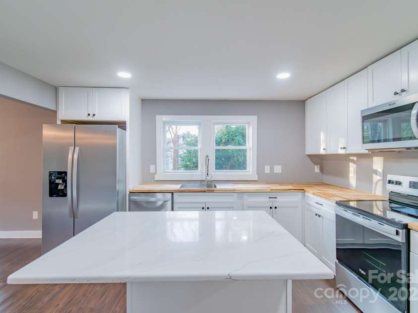 6282 Richburg Road, Great Falls, SC 29055.  MLS# CAR4235952, YatesRealty ID 8890. Kitchen Island doubles as breakfast bar.