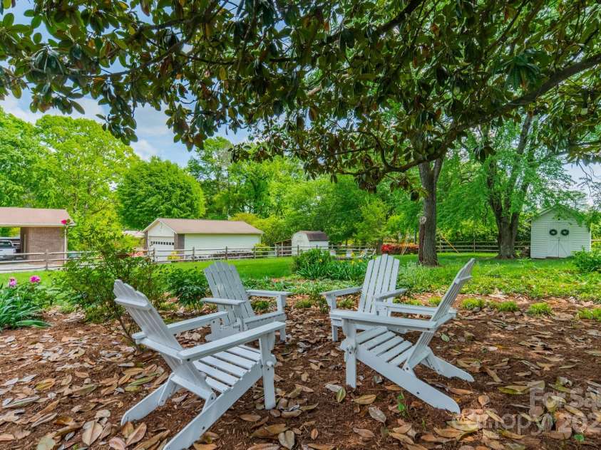 8330 Fallsdale Drive, Charlotte, NC 28214.  MLS# CAR4248517, YatesRealty ID 8896. Backyard Shaded Sitting Area