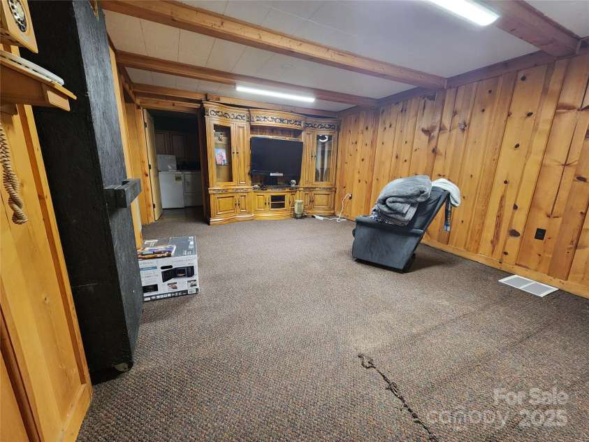 188 Paul Hurst Road, Franklin, NC 28734.  MLS# CAR4233199, YatesRealty ID 8897. Living room in basement