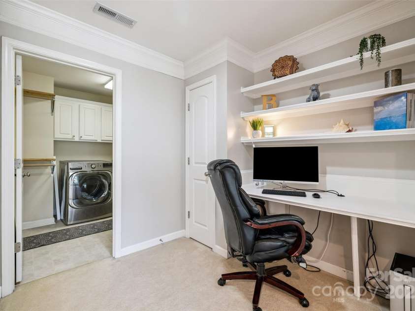 9142 Drayton Lane, Indian Land, SC 29707.  MLS# CAR4275785, YatesRealty ID 890. Built-in work station just outside of the Laundry room