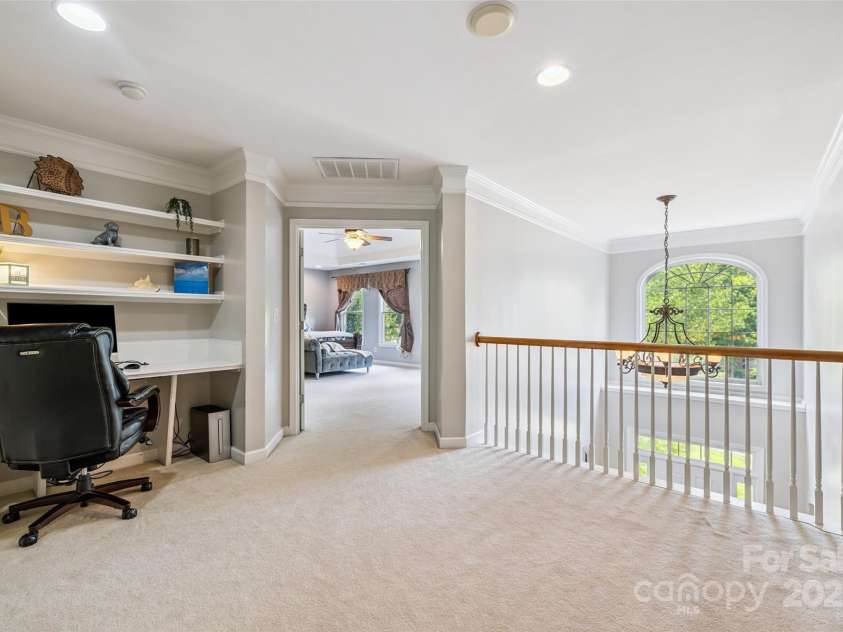 9142 Drayton Lane, Indian Land, SC 29707.  MLS# CAR4275785, YatesRealty ID 890. Spacious hallway leading up to the Primary bedroom