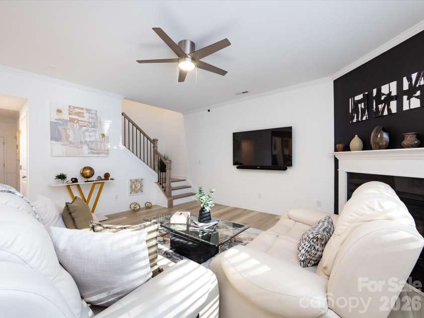 8903 Ansley Park Place, Huntersville, NC 28078.  MLS# CAR4366272, YatesRealty ID 8920. Bright and inviting great room featuring a cozy fireplace, abundant natural light, and open layout ideal for everyday living and entertaining.