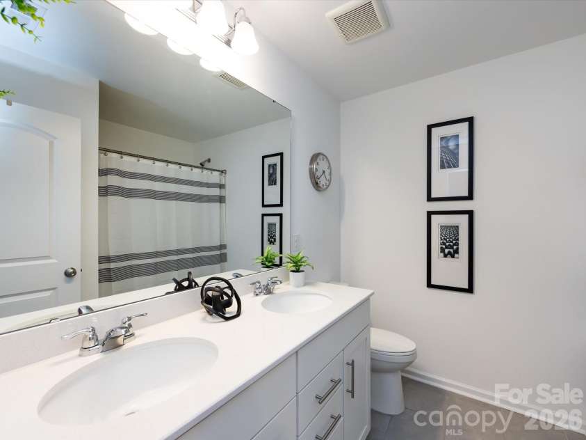 8903 Ansley Park Place, Huntersville, NC 28078.  MLS# CAR4366272, YatesRealty ID 8920. Full bathroom featuring a double vanity, ample counter space, and a tub/shower combination for added convenience.