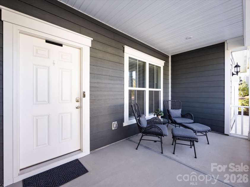 8903 Ansley Park Place, Huntersville, NC 28078.  MLS# CAR4366272, YatesRealty ID 8920. Inviting covered front porch with seating area, perfect for relaxing and enjoying the neighborhood views.