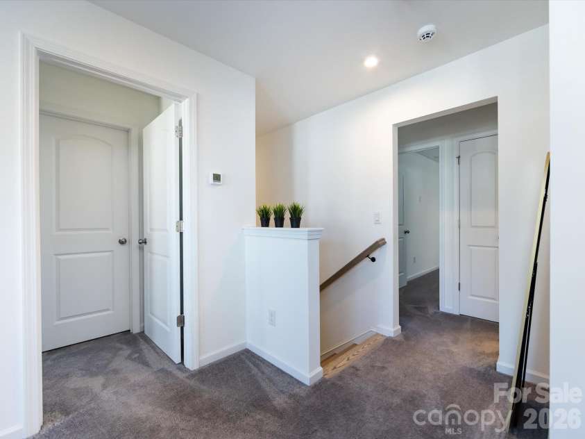 8903 Ansley Park Place, Huntersville, NC 28078.  MLS# CAR4366272, YatesRealty ID 8920. Open upstairs landing with plush carpeting and easy access to bedrooms, offering a bright and functional transition space.
