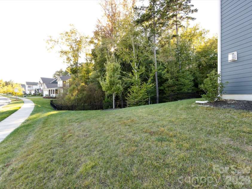 8903 Ansley Park Place, Huntersville, NC 28078.  MLS# CAR4366272, YatesRealty ID 8920. Private, tree-lined backyard offering a peaceful natural setting with gentle slope and neighborhood views.