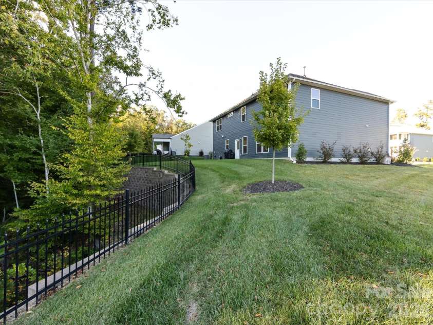 8903 Ansley Park Place, Huntersville, NC 28078.  MLS# CAR4366272, YatesRealty ID 8920. Private, tree-lined backyard offering a peaceful natural setting with gentle slope and neighborhood views.