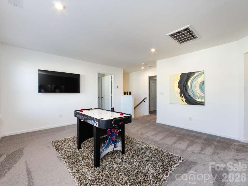 8903 Ansley Park Place, Huntersville, NC 28078.  MLS# CAR4366272, YatesRealty ID 8920. Spacious loft area filled with natural light, perfect for a game room, media space, or additional living area.