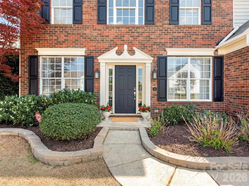 2306 Winthorp Ridge Road, Charlotte, NC 28270.  MLS# CAR4364303, YatesRealty ID 8930. Brick Front Home with Stacked Stone landscaping and nice shrubbery!