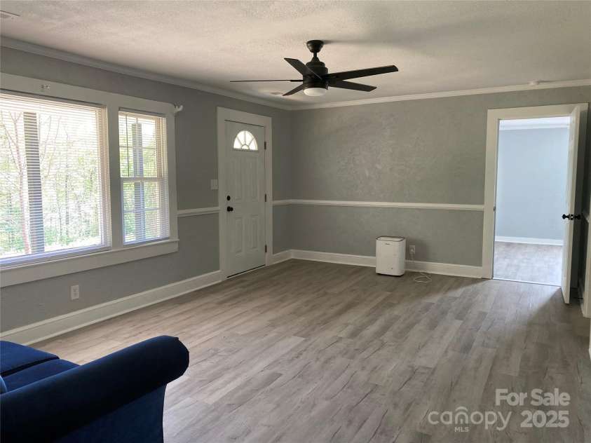 1244 Piedmont Drive, Lenoir, NC 28645.  MLS# CAR4250326, YatesRealty ID 8935. View from living room into large bedroom