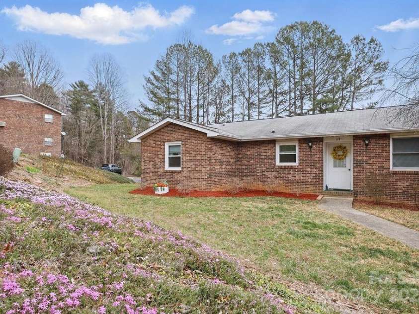 114 Falling Waters Road, Hendersonville, NC 28792.  MLS# CAR4228778, YatesRealty ID 8938. Front of home on street level