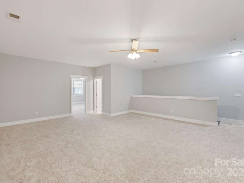 704 Kenway Loop, Mooresville, NC 28117.  MLS# CAR4274893, YatesRealty ID 894. Spacious enough for a hobby area, gym, movie theater, game room, many possibilities.