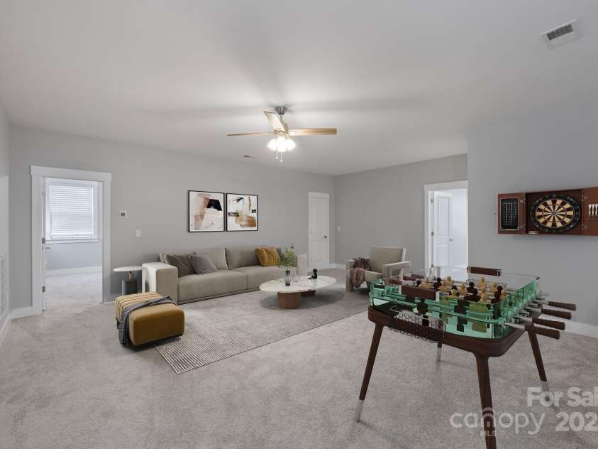 704 Kenway Loop, Mooresville, NC 28117.  MLS# CAR4274893, YatesRealty ID 894. Upper area hangout virtually staged