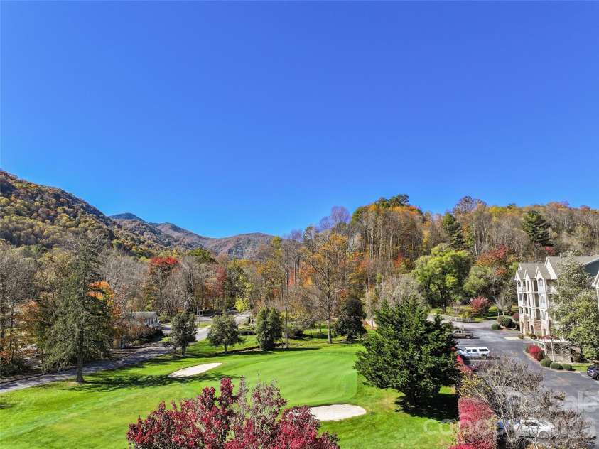 91 Glenview Lane, Maggie Valley, NC 28751.  MLS# CAR4312571, YatesRealty ID 8940. Arial from parking lot looking West