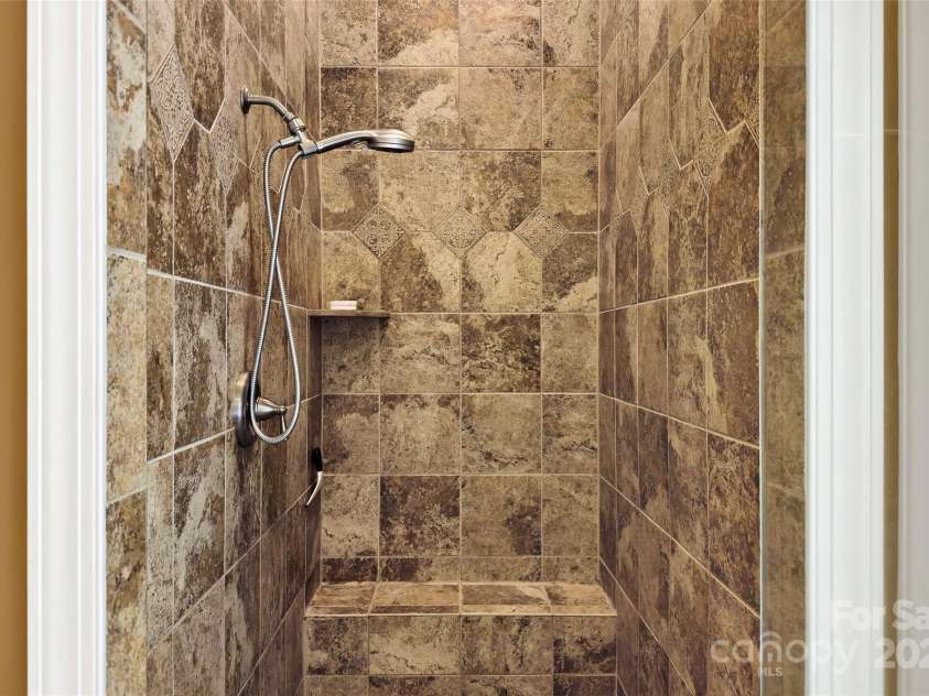 941 Wash Freeman Road, Hendersonville, NC 28792.  MLS# CAR4227062, YatesRealty ID 8941. Elegant tile shower with tall ceilings