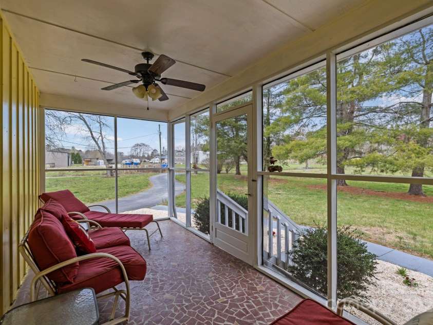 1450 Cane Creek Road, Fletcher, NC 28732.  MLS# CAR4241645, YatesRealty ID 8942. Screened in Porch