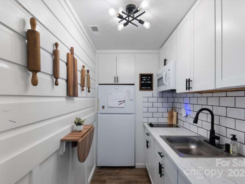 732 Crowe Dairy Road, Forest City, NC 28043.  MLS# CAR4234052, YatesRealty ID 895. Kitchenette in basement.