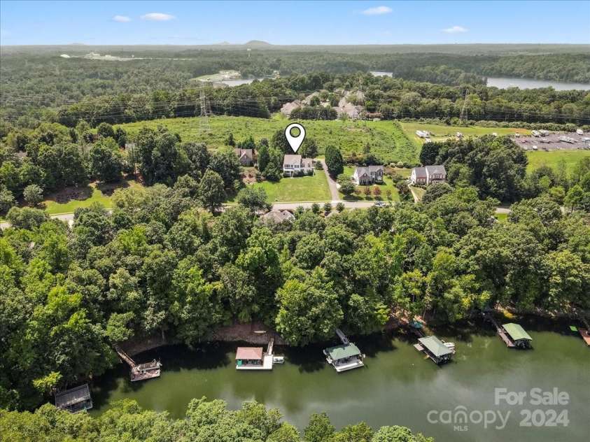 1900 Mt Isle Harbor Drive, Charlotte, NC 28214.  MLS# CAR4170901, YatesRealty ID 8956. Lake & House