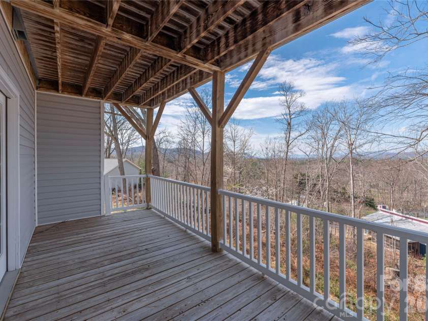 11 Briar Ridge Drive, Fairview, NC 28730.  MLS# CAR4350969, YatesRealty ID 8958. Covered Deck off Basement