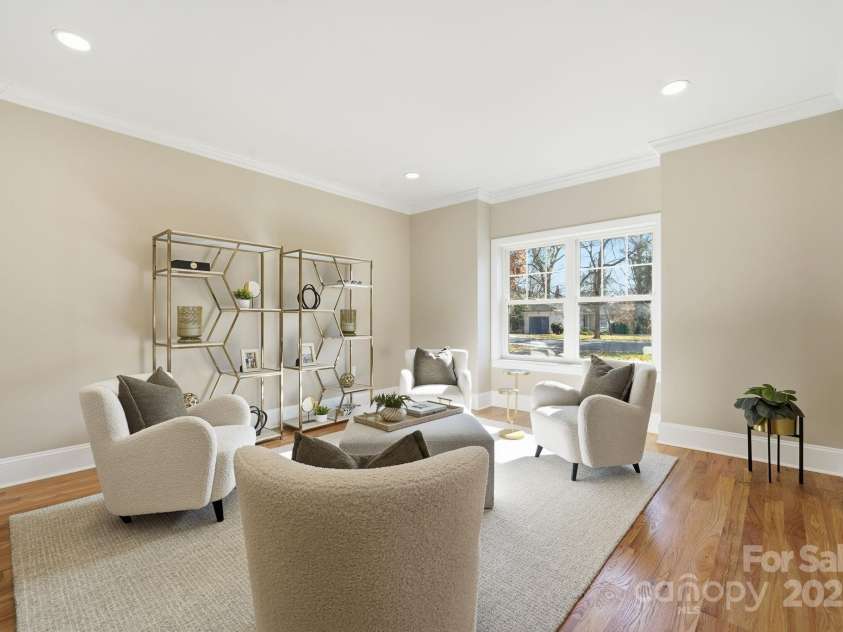 101 Mcalway Road, Charlotte, NC 28211.  MLS# CAR4321405, YatesRealty ID 896. ? Another angle of the front lounge showcasing the elegant layout and sunny window views.