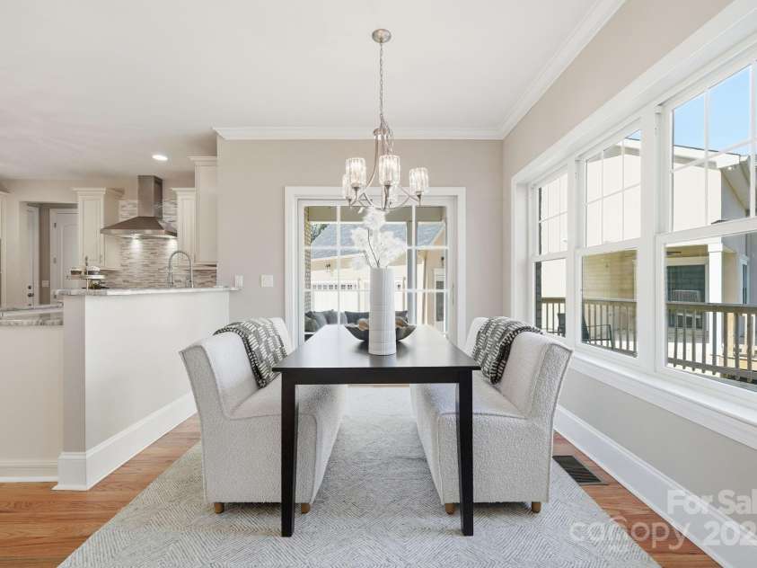 101 Mcalway Road, Charlotte, NC 28211.  MLS# CAR4321405, YatesRealty ID 896. Breakfast nook surrounded by windows — bright, inviting, and perfect for morning coffee.
