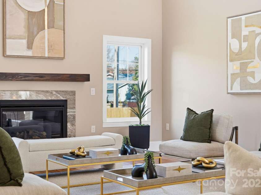 101 Mcalway Road, Charlotte, NC 28211.  MLS# CAR4321405, YatesRealty ID 896.  Dining room with stylish artwork and refined finishes — perfect for entertaining.