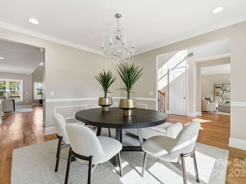 101 Mcalway Road, Charlotte, NC 28211.  MLS# CAR4321405, YatesRealty ID 896. Formal dining room looking toward the foyer — a grand space for gatherings.
