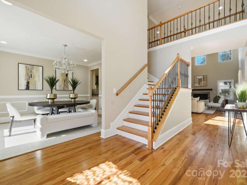 101 Mcalway Road, Charlotte, NC 28211.  MLS# CAR4321405, YatesRealty ID 896. Grand two-story foyer with wrought-iron staircase and beautiful natural light.