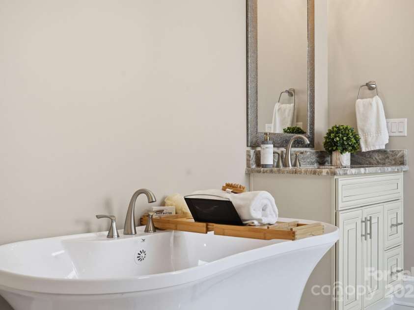101 Mcalway Road, Charlotte, NC 28211.  MLS# CAR4321405, YatesRealty ID 896. Primary suite freestanding soaking tub — spa-inspired luxury in your own home.