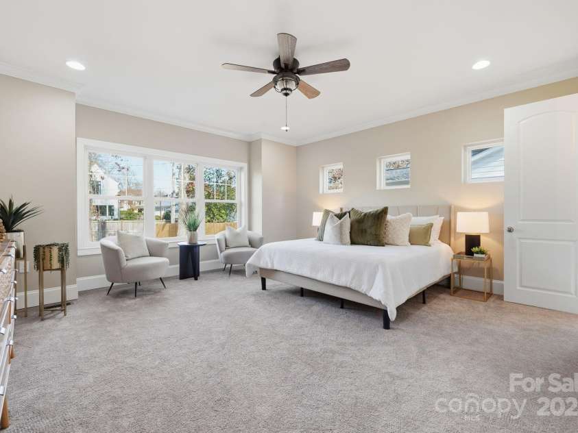 101 Mcalway Road, Charlotte, NC 28211.  MLS# CAR4321405, YatesRealty ID 896.  Primary suite with oversized window wall — beautifully bright and inviting.