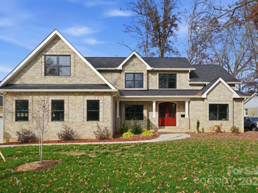 101 Mcalway Road, Charlotte, NC 28211.  MLS# CAR4321405, YatesRealty ID 896. Stunning full front elevation with red double-door entry — a true modern classic.