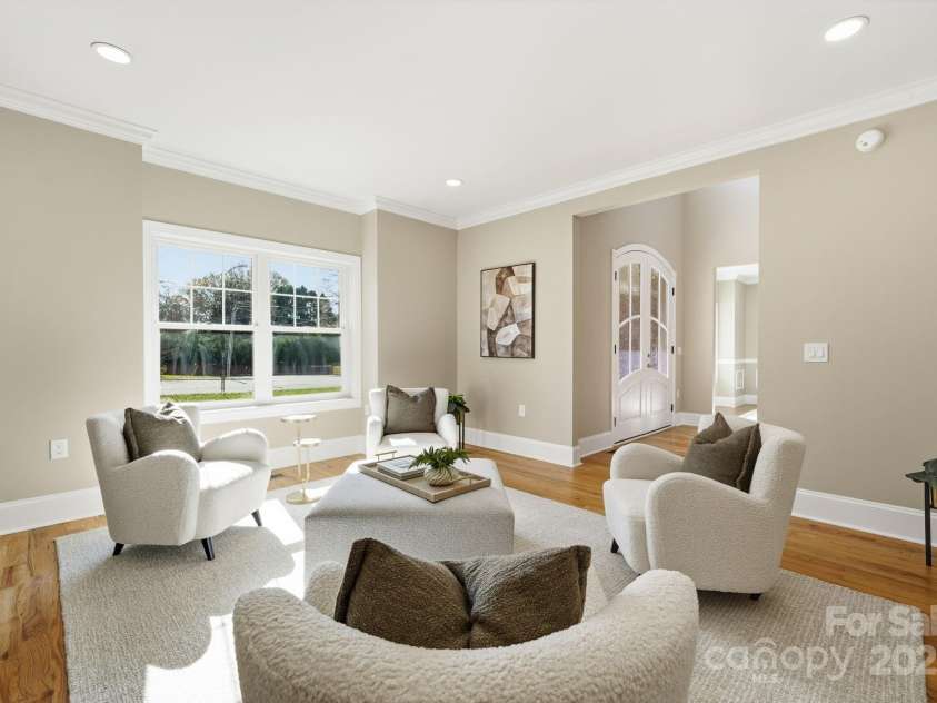 101 Mcalway Road, Charlotte, NC 28211.  MLS# CAR4321405, YatesRealty ID 896. Stylish front living room with designer seating and abundant natural light.