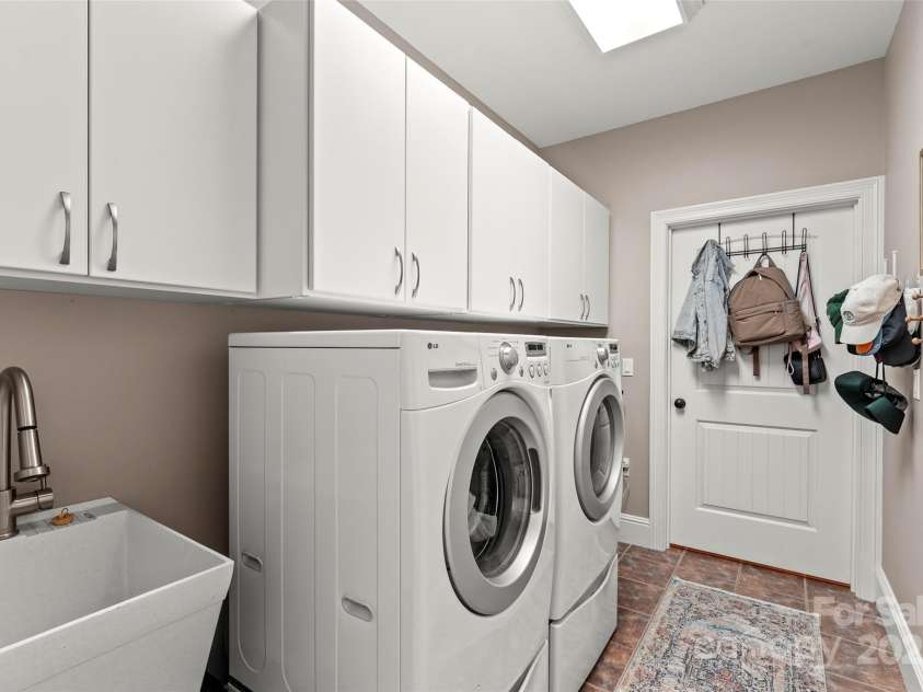 28 Sovereign Lane, Fairview, NC 28730.  MLS# CAR4226079, YatesRealty ID 8961. Huge laundry room