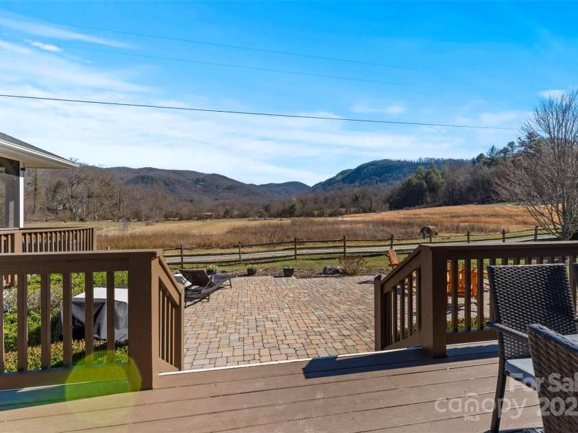 28 Sovereign Lane, Fairview, NC 28730.  MLS# CAR4226079, YatesRealty ID 8961. Peaceful moments on your freshly painted deck