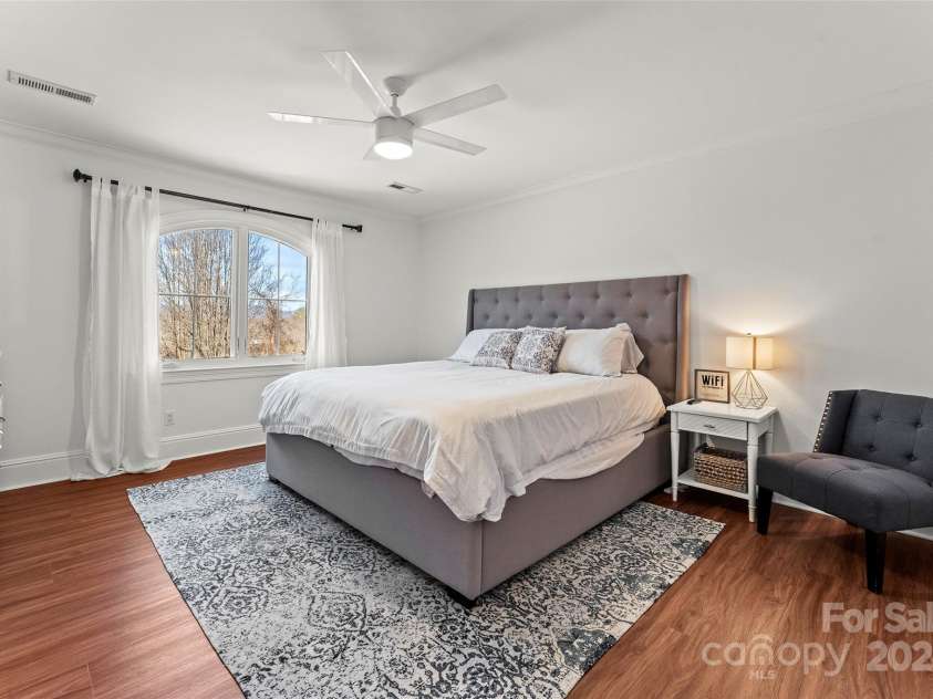 28 Sovereign Lane, Fairview, NC 28730.  MLS# CAR4226079, YatesRealty ID 8961. Roomy bedroom with connected bathroom