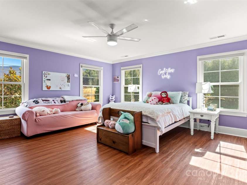 28 Sovereign Lane, Fairview, NC 28730.  MLS# CAR4226079, YatesRealty ID 8961. Upper level bedroom with ensuite