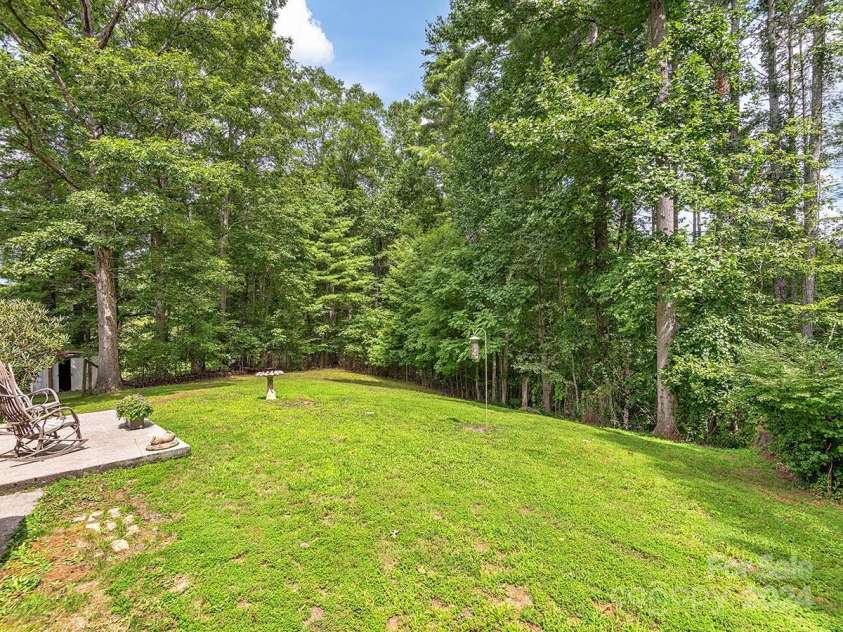 184 Upper White Oak Road, Mars Hill, NC 28754.  MLS# CAR4187288, YatesRealty ID 897. Back yard and porch. You may get a visitor or two!