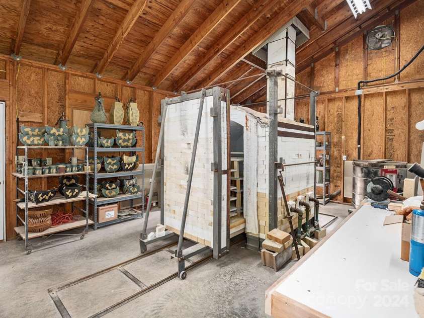 184 Upper White Oak Road, Mars Hill, NC 28754.  MLS# CAR4187288, YatesRealty ID 897. Space off the side of the studio houses the gas kiln. (pottery equipment available for purchase)